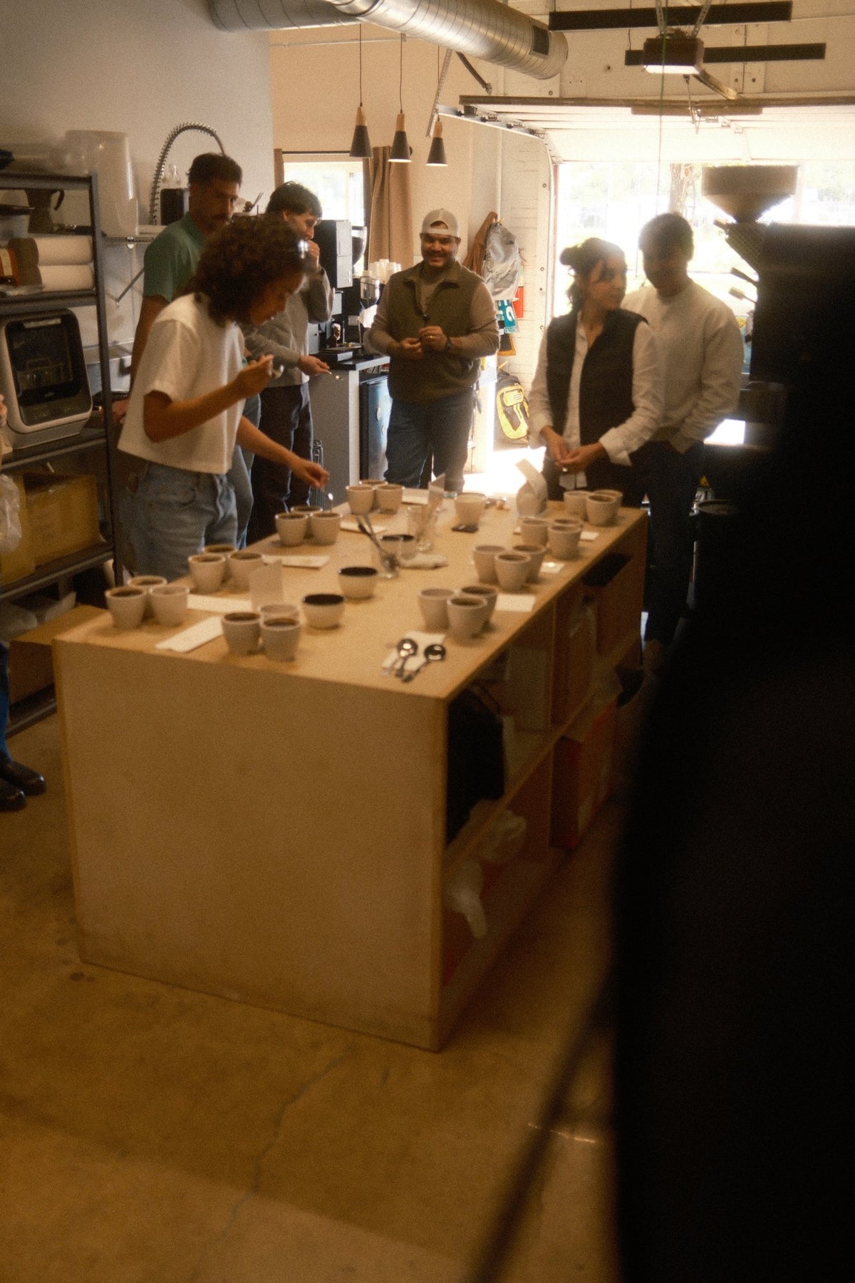 Participants gathered around the coffee cupping table at Viewfinder Coffee.